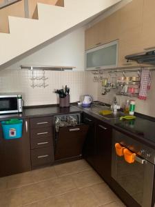 a kitchen with a sink and a counter top at Lilo in Dobra Voda