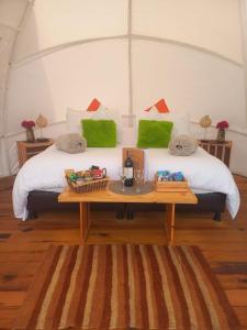 Un pat sau paturi într-o cameră la Origen Glamping en Villa de Leyva