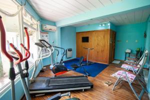 a room with a gym with exercise equipment in it at Hotel y Spa Termas del Este in Federación