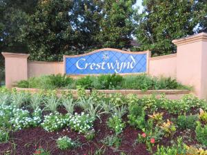 a sign for a garden with flowers and plants at Kissimmee townhome 3 miles to Disney! in Orlando