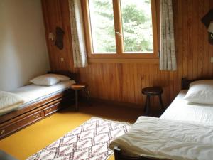 Кровать или кровати в номере Appartement Châtel, 2 pièces, 6 personnes - FR-1-200-224