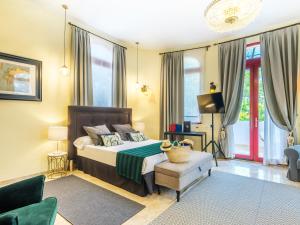 Postel nebo postele na pokoji v ubytování Hotel Ciutat Jardi