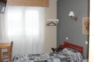 Postel nebo postele na pokoji v ubytování Accueil Savoyard