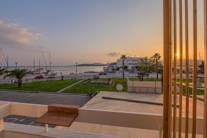 a view of a harbor from a building at ELA apartments in Volos