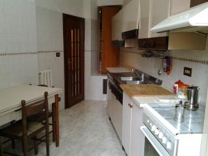 A kitchen or kitchenette at Casa Vacanze Scalone