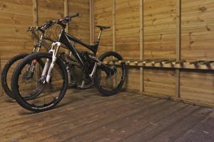 a bike is parked in a wooden building at The Vagabond Bunkhouse in Betws-y-coed