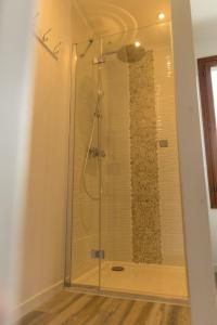 a shower with a glass door in a bathroom at MAISON NATURE ET DETENTE AUX PORTES DE LA BAIE in Chépy