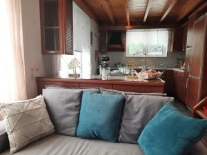 a couch with pillows sitting in a kitchen at AVIA SERENITY COUNTRYHOUSE in Kalamata