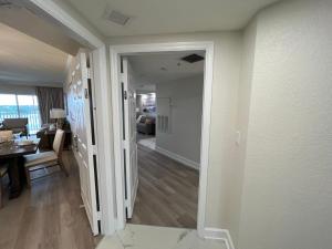 a hallway with a dining room and a living room at 5 minutes away from Disney, Westgate Resort in Orlando