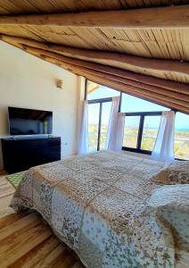 a bedroom with a bed and a large window at Oasis de Vichayito in Vichayito +67 photos