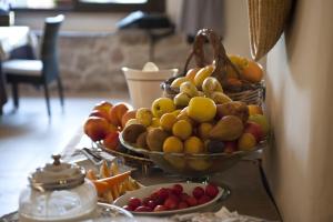 two bowls of fruit sitting on a table at Nascar Hotel in Santa Maria Navarrese