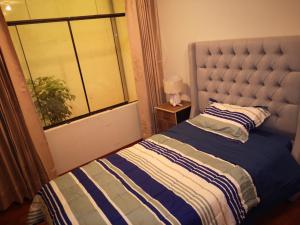 Ein Bett oder Betten in einem Zimmer der Unterkunft Miski Wasi