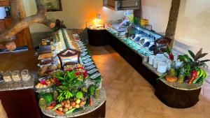 a table topped with lots of different types of food at Los Lagos Spa & Thermal Resort Experience in Fortuna