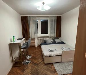 Łóżko lub łóżka w pokoju w obiekcie :: Apartment City Center ::