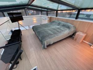 a bed in the middle of a room on a boat at Arctic Iglu Levi in Sirkka