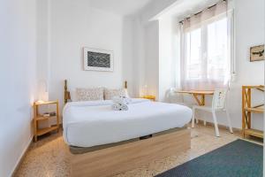 Postel nebo postele na pokoji v ubytování Hostal El Perelló, Valencia