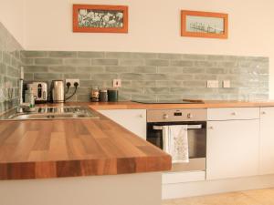 a kitchen with a sink and a counter top at Robins Nest - Uk40747 in Coddington