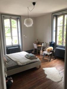 Posteľ alebo postele v izbe v ubytovaní Grand appartement dans belle maison avec jardin