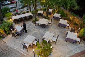 an overhead view of a restaurant with tables and chairs at Nascar Hotel in Santa Maria Navarrese