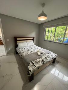 Postelja oz. postelje v sobi nastanitve Apartamento Decorado em Domingos Martins