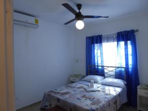 Postel nebo postele na pokoji v ubytování CortLang Vacation Rentals, El Pueblito