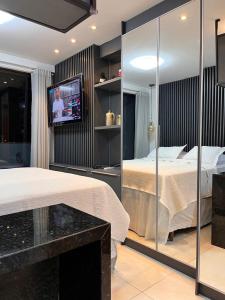 Ein Badezimmer in der Unterkunft » MODERNO E ACONCHEGANTE FLAT COM VARANDA «