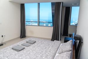 Postel nebo postele na pokoji v ubytování SuperHost Experience-2 bedroom-SeaView-Ocean Heights