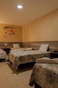 Cama ou camas em um quarto em Hotel El Huacachinero