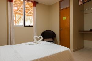 Cama ou camas em um quarto em Hotel El Huacachinero