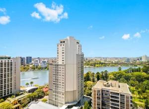 an aerial view of a city with a river and buildings at Lvl 24 Family apartment in the heart of CBD by Stylish Stays in Brisbane