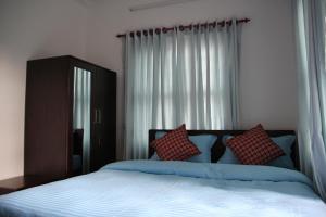 Katil atau katil-katil dalam bilik di Hope Guest House