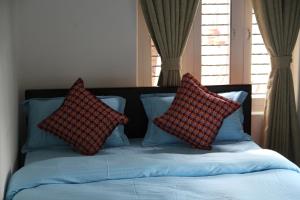Katil atau katil-katil dalam bilik di Hope Guest House