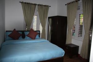 Katil atau katil-katil dalam bilik di Hope Guest House