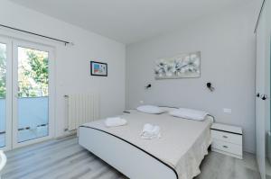 Postel nebo postele na pokoji v ubytování Apartments Marija G
