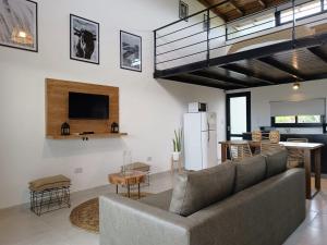 a large living room with a couch and a table at Terrazas del Monte in San Miguel del Monte