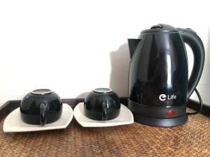 a coffee maker and a tea kettle on a table at Phangan Lodge in Ban Tai