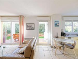 a living room with a couch and a table at Appartement Bayonne, 2 pièces, 2 personnes - FR-1-3-538 in Bayonne