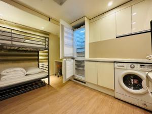 a laundry room with a washer and dryer at Olive hostel R(Residence) in Seoul