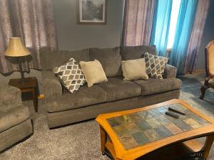 a living room with a couch and a coffee table at Lodge 545 Complete Large brick house fully furnished in Agra