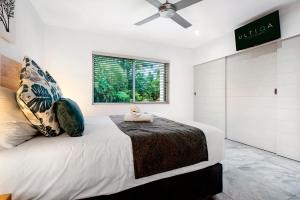 Letto o letti in una camera di ULTIQA Fiji Palms Beach Resort