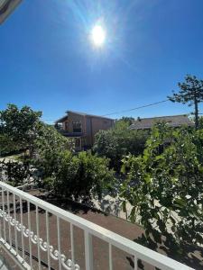 a balcony with a white fence and some bushes at Senem Villa ile tatili eviniz konforunda hissedin in Silivri