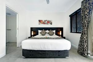 Letto o letti in una camera di ULTIQA Fiji Palms Beach Resort