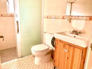 a bathroom with a toilet and a sink at 兆億申襄采民宿1741 Zhao Yì Shen Xiang Cai Homestay 1741 in Wujie