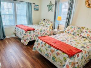 Postel nebo postele na pokoji v ubytování Seaside