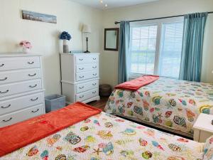 Postel nebo postele na pokoji v ubytování Seaside