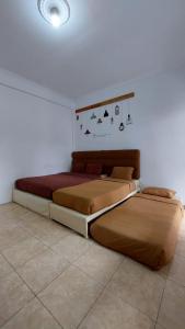 Кровать или кровати в номере Al Barra Syariah Hotel