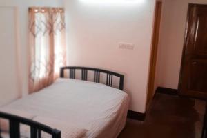 Säng eller sängar i ett rum på Ashiana Serviced Apartment