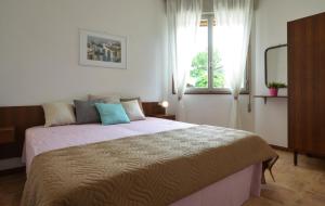 A bed or beds in a room at Ville Battiston