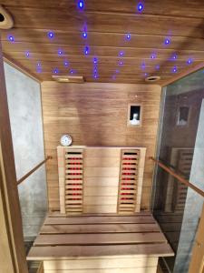 a sauna with blue lights on the ceiling at Tendresse - Espace Détente Ensival in Verviers