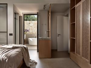 A bed or beds in a room at Cielo villas - An Authentic Mediterranean Living